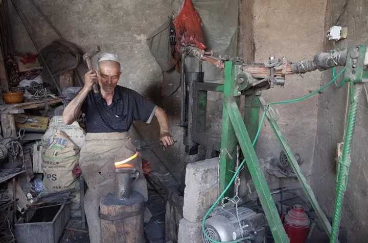 张景镜头下的手艺人.图片来自网络