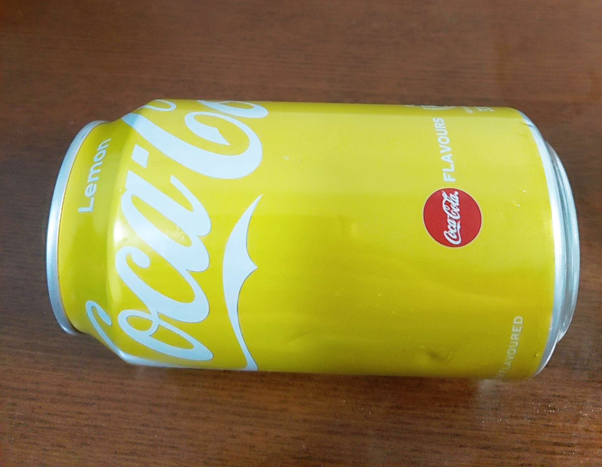 柠檬薄荷猫 的想法: 今天逛街时看到了黄色罐子的可口可乐,直