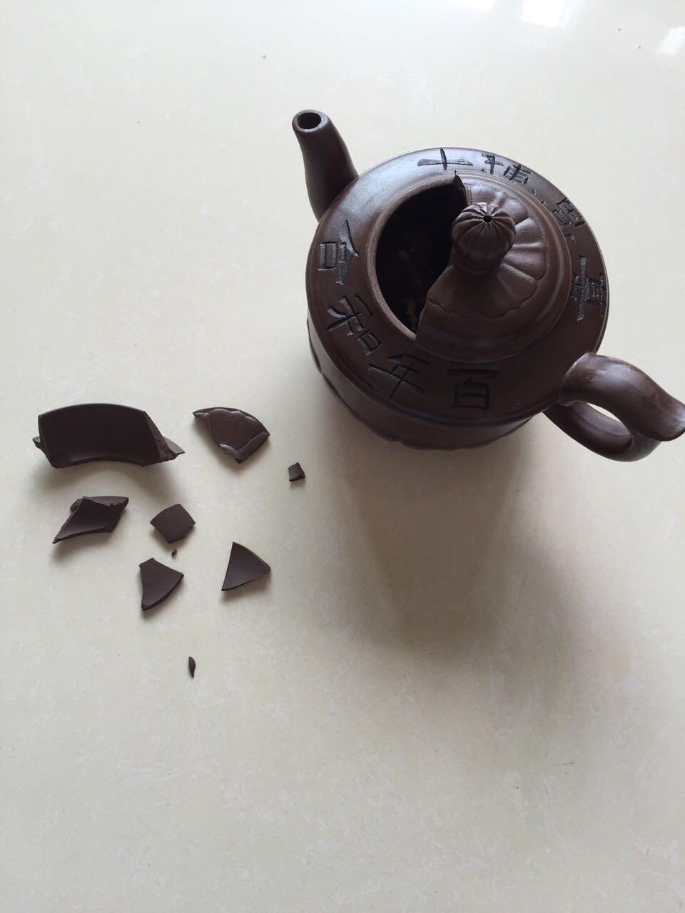 紫砂壶的壶盖摔裂了如何修复