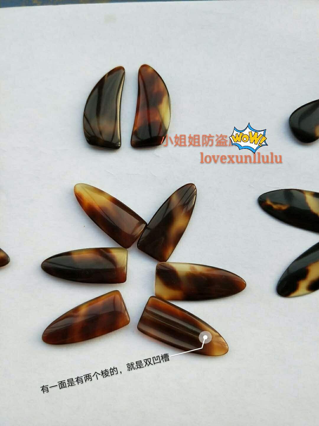 撇开个人习惯问题,古筝指甲中,凹槽、单面弧、