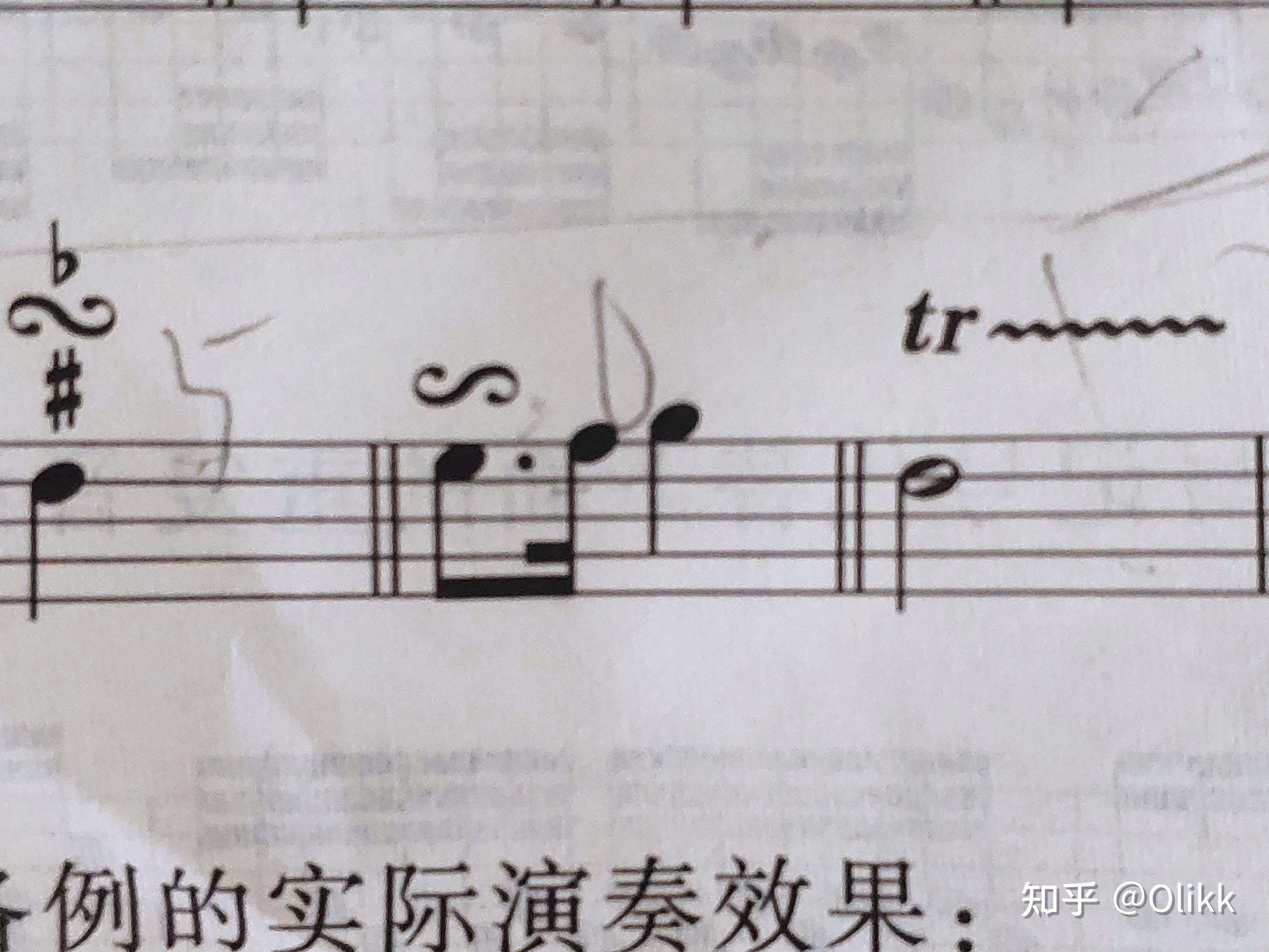 这个附点音符上反过来的回音记号到底怎么演奏啊