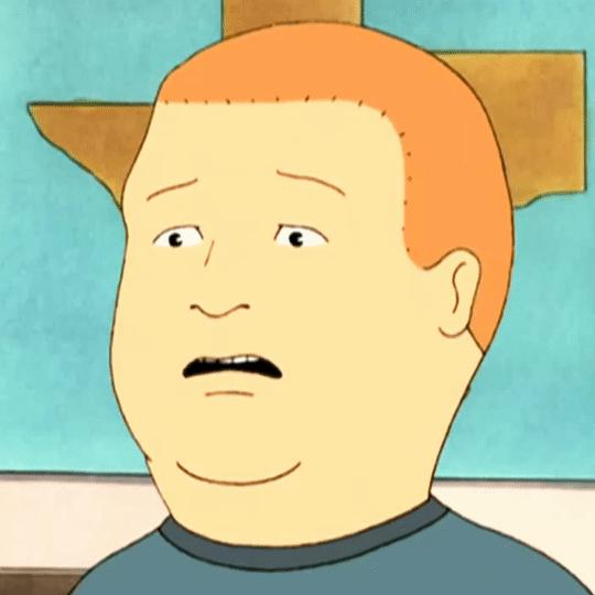 学生会所在地旁边有一个巨大的ucla吉祥物the bruin熊的雕塑,学生们在