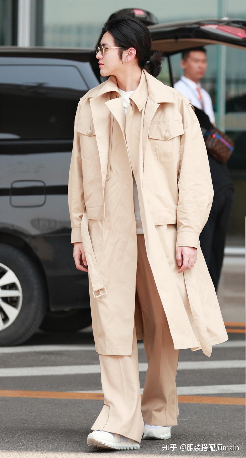 吴亦凡穿风衣长裤走机场,戴墨镜斯文帅气,小辫子扎成花苞也时髦